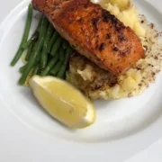 PAN FRIED SALMON served with crushed new potatoes and ﬁne green beans